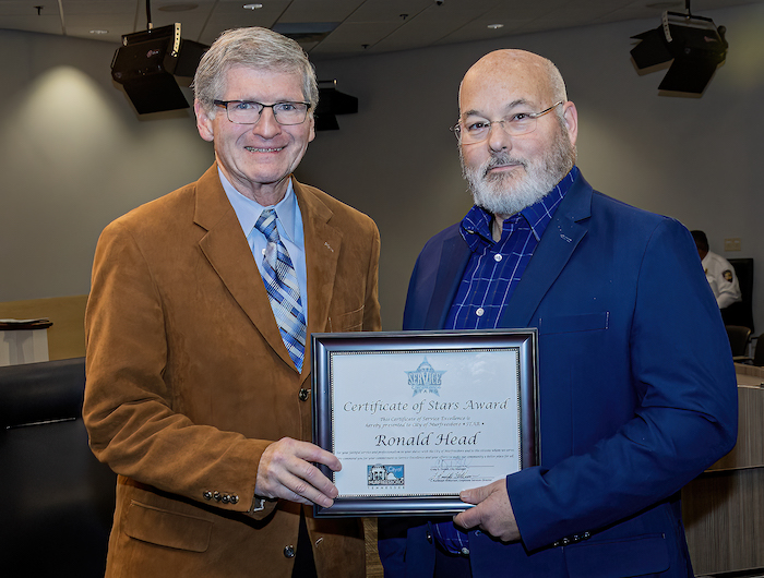 I.T. Systems Coordinator Ronald Head with STARS Award
