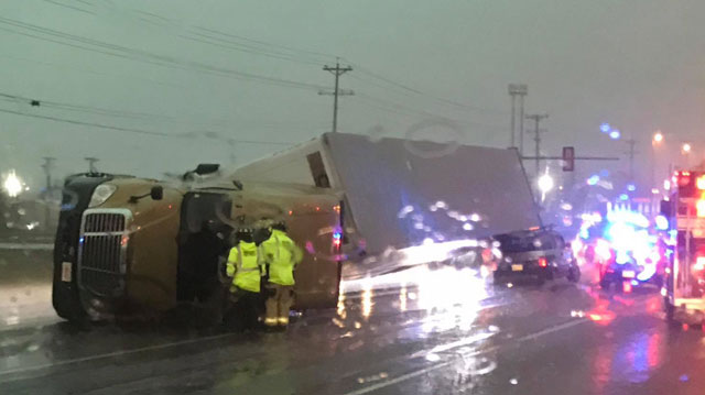 Tractor-trailer blows over, lands on SUV in Nashville