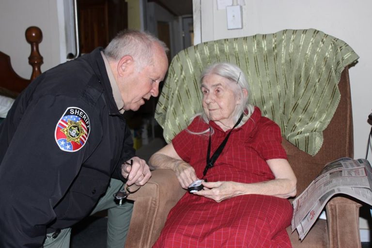 SCAN Members Receive Alert Buttons from Villages Donation