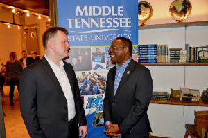 MTSU President Sidney A. McPhee, left, chats with multiple Grammy award nominee and 2000 School of Music alumnus Wayne Haun, who is nominated again this year as part of the best roots gospel album category for producing “Clear Skies” by Ernie Haase & Signature Sound. (MTSU photo by Andrew Oppmann)