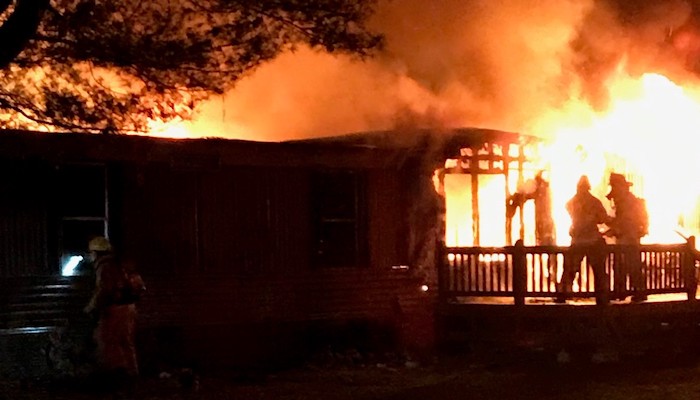 SFD personnel battling fire