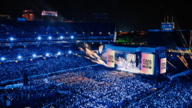 CMA Fest crowd at Nissan Stadium Nashville with stage lights