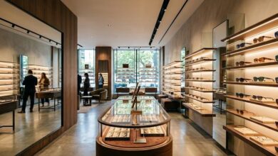 Interior of the KREWE eyewear boutique on Nashville 12 South, with sculptural sunglasses and colored acetate frames displayed on backlit shelves