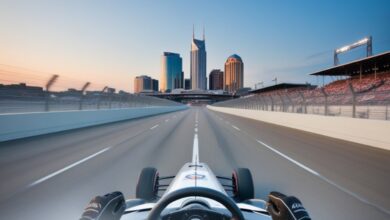 First-person driver's view from an IndyCar racing toward the downtown Nashville skyline at the Music City Grand Prix