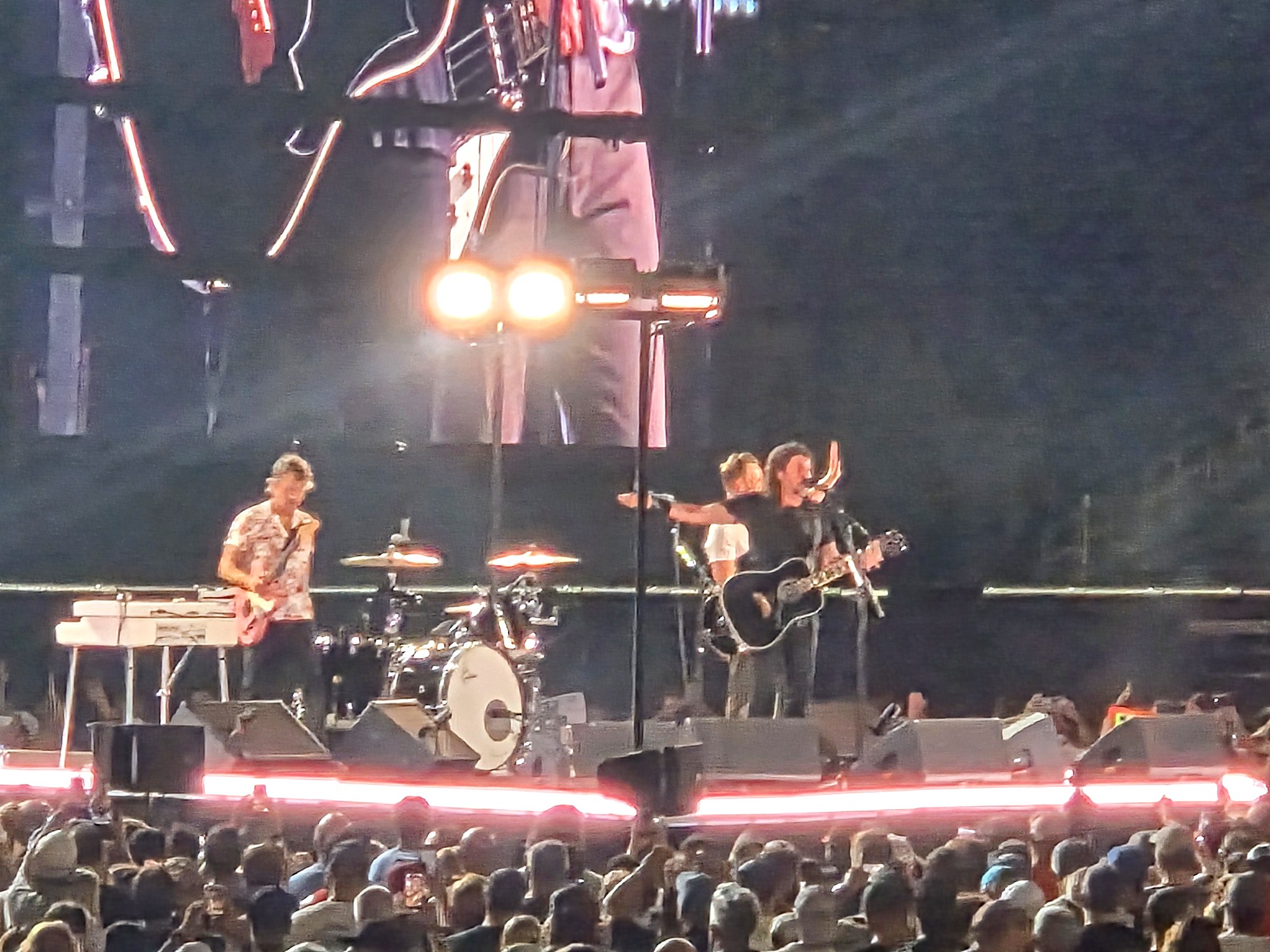 Foo Fighters on stage at Nissan Stadium in Nashville with the crowd's hands raised during the final concert at the venue on August 15, 2026
