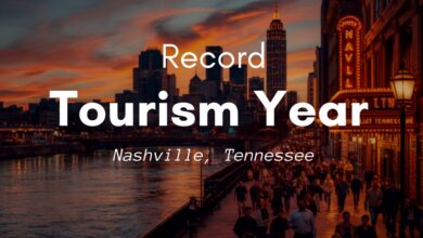 Downtown Nashville skyline and crowded riverfront walkway at dusk, marking a record tourism year (illustrative)