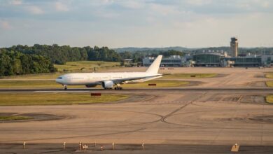 A widebody passenger jet holding on a runway at a Southern U.S. airport at golden hour (illustrative)