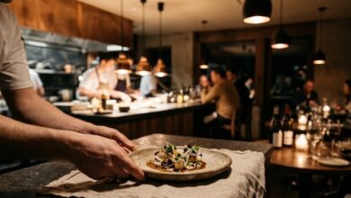 Plated tasting-menu course at a chef's counter in an upscale restaurant (illustrative)